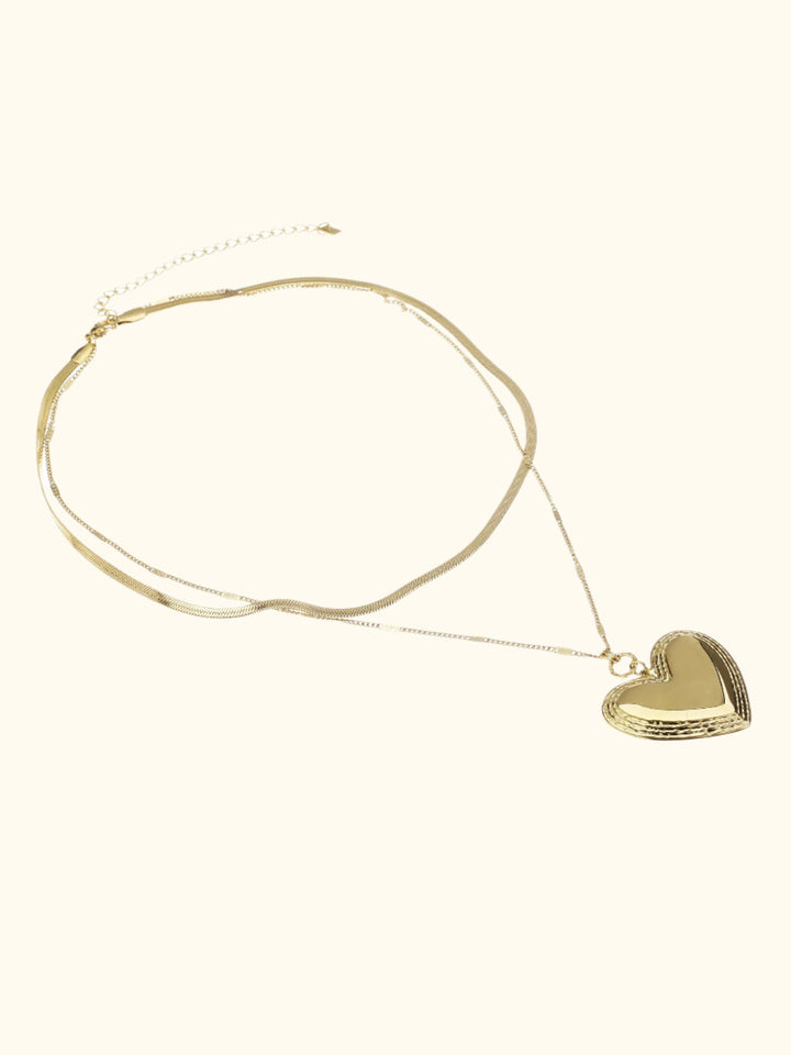 Dubbele ketting met statement hart hanger